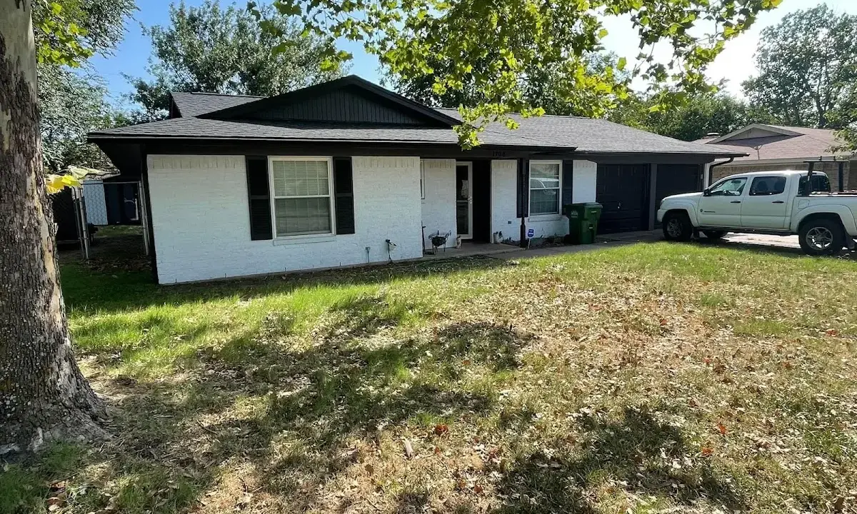 Professional roofing crew working on a residential roof in Cinnaminson